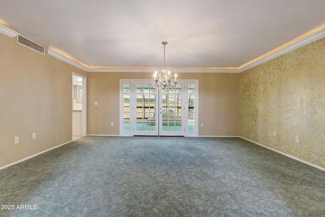 carpeted empty room with ornamental molding, baseboards, a chandelier, and visible vents