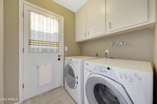 laundry area featuring cabinet space and washing machine and dryer