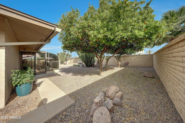 view of yard with a fenced backyard