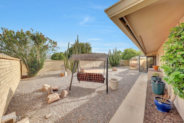 view of yard with a fenced backyard and a patio area