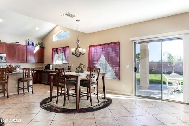 dining space featuring a wealth of natural light, light tile patterned floors, and lofted ceiling