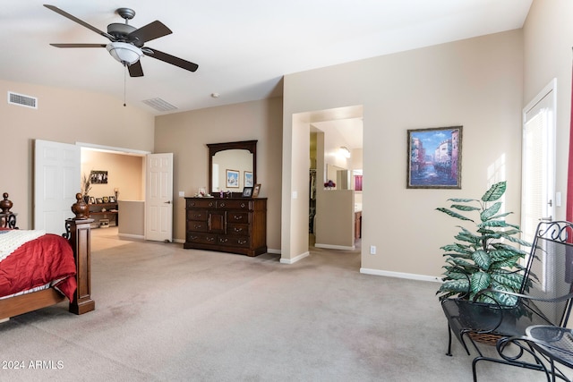 carpeted bedroom featuring ensuite bath and ceiling fan