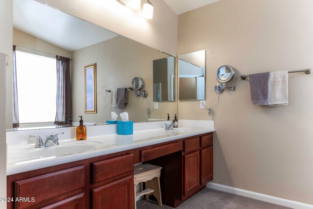 bathroom featuring vanity and lofted ceiling