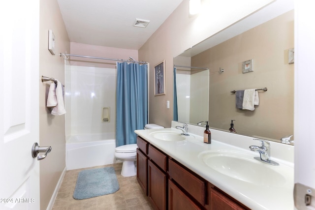 full bathroom featuring shower / bath combo, toilet, and vanity