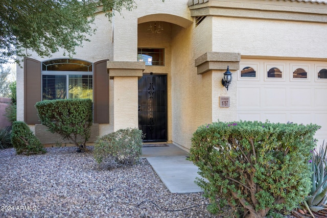 property entrance with a garage