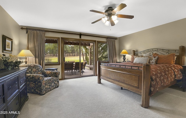 bedroom with carpet floors, ceiling fan, access to exterior, and multiple windows
