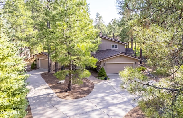 view of front of property with concrete driveway and a garage