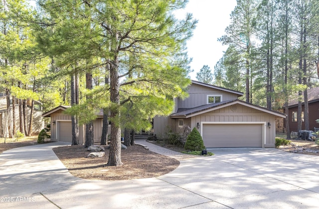 view of front of home featuring an attached garage and concrete driveway
