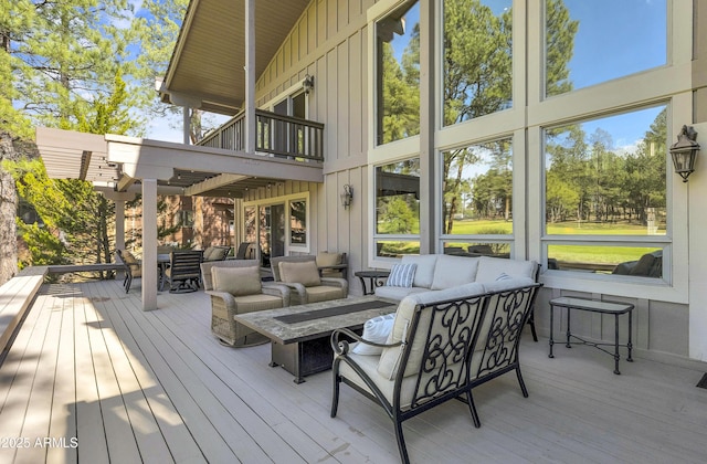 deck featuring outdoor lounge area