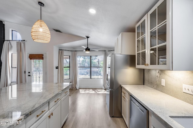 4443 W Escuda Dr, Glendale, AZ 85308 - kitchen with appliances with stainless steel finishes, tasteful backsplash, ceiling fan, plenty of natural light, and lofted ceiling