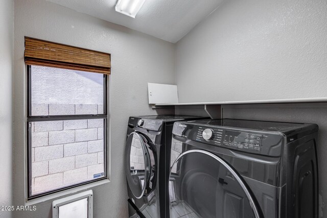 4443 W Escuda Dr, Glendale, AZ 85308 - laundry area featuring independent washer and dryer and a textured wall