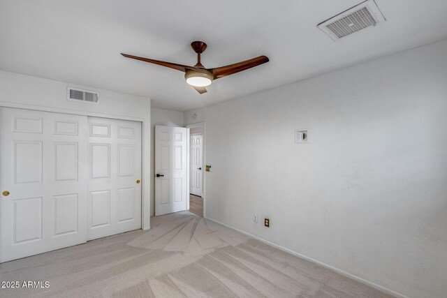 4443 W Escuda Dr, Glendale, AZ 85308 - unfurnished bedroom with light colored carpet, a closet, baseboards, and ceiling fan