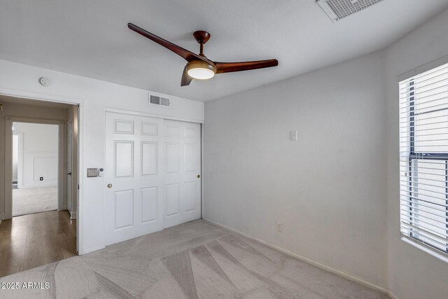 4443 W Escuda Dr, Glendale, AZ 85308 - unfurnished bedroom featuring multiple windows, a closet, baseboards, and ceiling fan