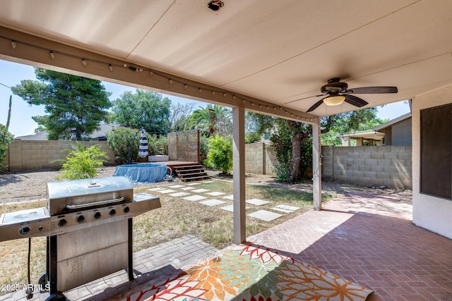 4443 W Escuda Dr, Glendale, AZ 85308 - fenced backyard with grilling area, a ceiling fan, and a patio