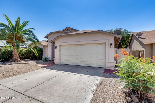 4443 W Escuda Dr, Glendale, AZ 85308 - ranch-style house featuring stucco siding, concrete driveway, and a garage