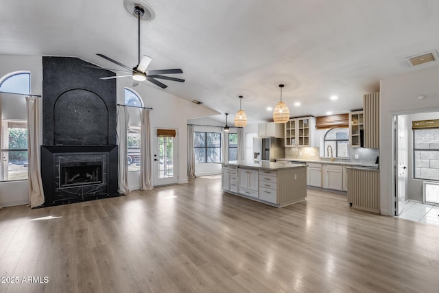 4443 W Escuda Dr, Glendale, AZ 85308 - kitchen featuring stainless steel fridge with ice dispenser, ceiling fan, a center island, open floor plan, and a sink