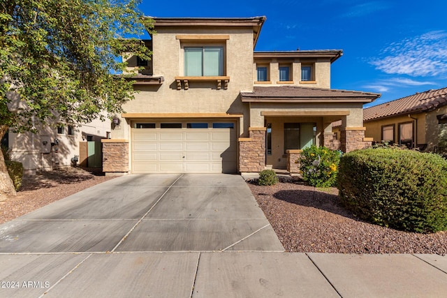 prairie-style house featuring a garage