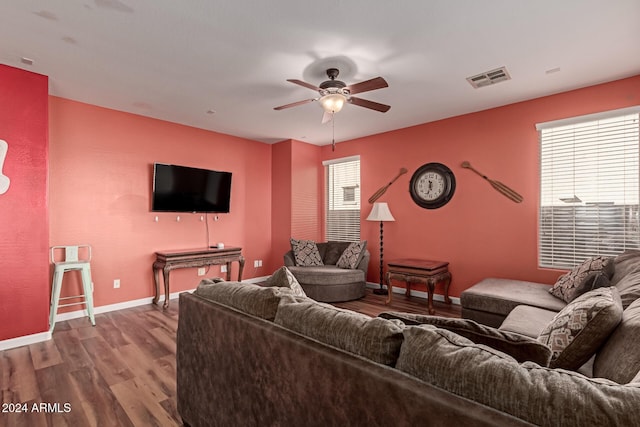 living room featuring hardwood / wood-style flooring, a wealth of natural light, and ceiling fan