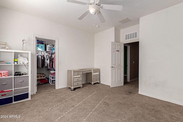 unfurnished bedroom with ceiling fan, carpet floors, and a closet