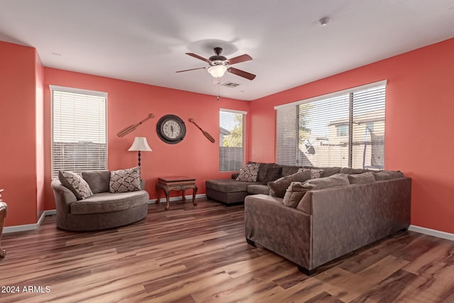 living room with ceiling fan and hardwood / wood-style floors