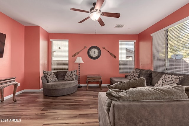 living room with hardwood / wood-style flooring, plenty of natural light, and ceiling fan