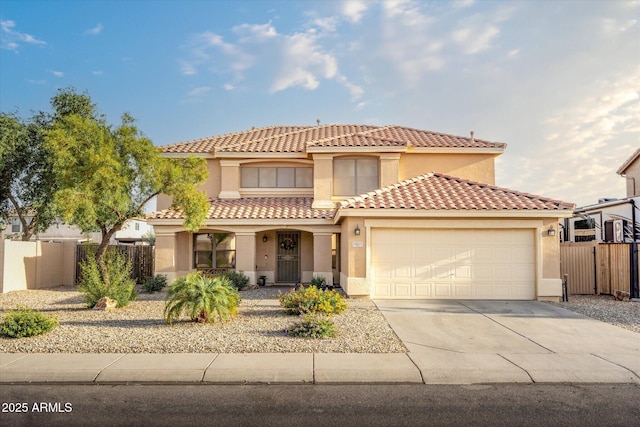 10617 W Daley Ln, Peoria, AZ 85383 - mediterranean / spanish-style home with stucco siding, fence, an attached garage, and driveway