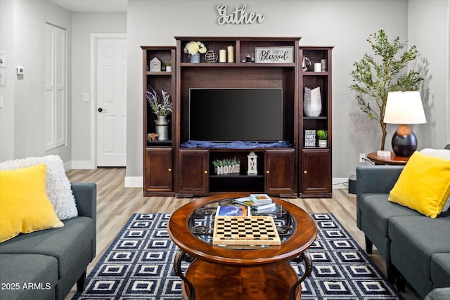 10617 W Daley Ln, Peoria, AZ 85383 - living area with light wood finished floors and baseboards
