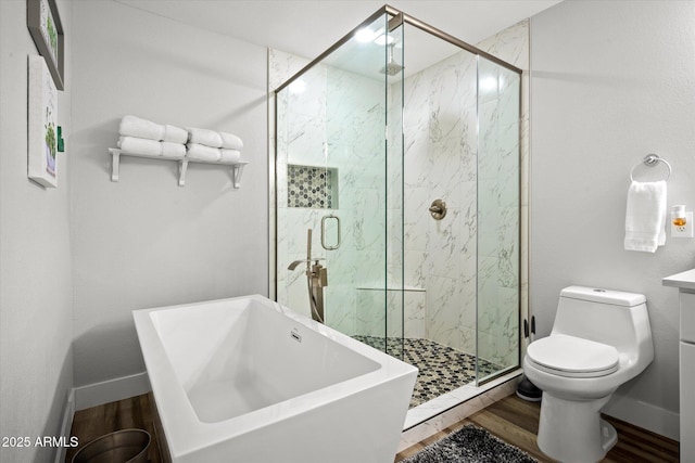 10617 W Daley Ln, Peoria, AZ 85383 - full bathroom featuring wood finished floors, toilet, a marble finish shower, and a soaking tub