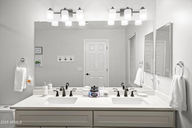 10617 W Daley Ln, Peoria, AZ 85383 - bathroom featuring double vanity and toilet