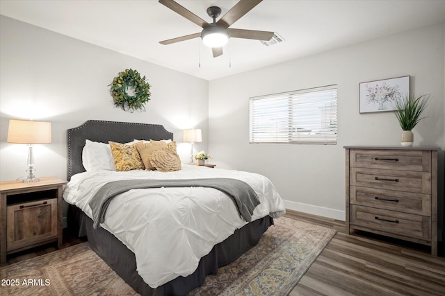 10617 W Daley Ln, Peoria, AZ 85383 - bedroom with baseboards, wood finished floors, and ceiling fan