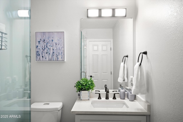 10617 W Daley Ln, Peoria, AZ 85383 - bathroom featuring toilet, a stall shower, and vanity