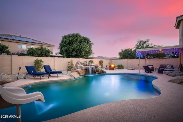 10617 W Daley Ln, Peoria, AZ 85383 - view of swimming pool featuring a patio, a water slide, a fenced backyard, and a fire pit