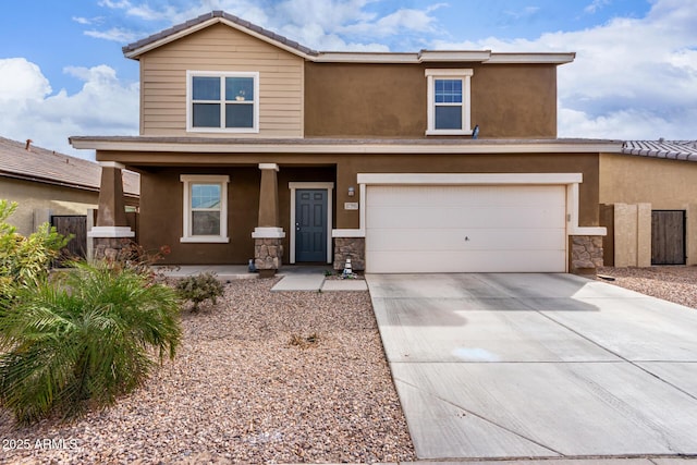 view of front of home with a garage and covered porch