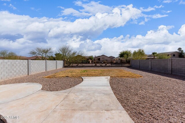 view of yard with a fenced backyard