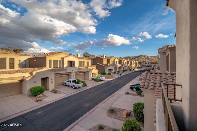 view of street featuring a residential view and a mountain view