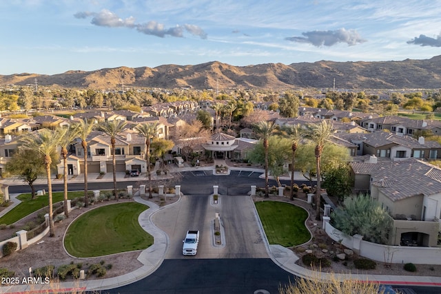 drone / aerial view with a residential view and a mountain view