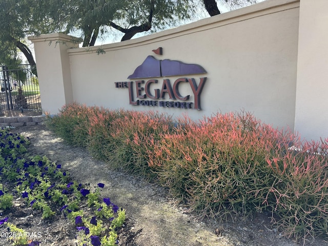 community sign featuring fence