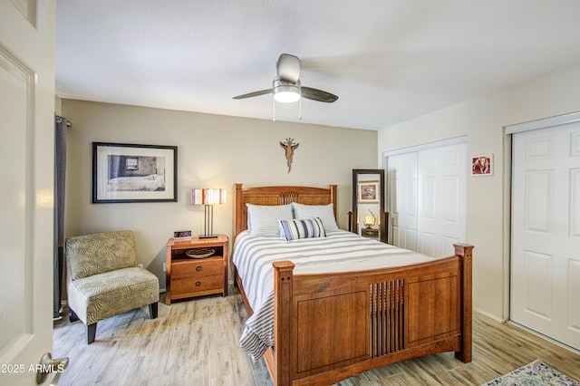 bedroom with light wood-style floors and a ceiling fan