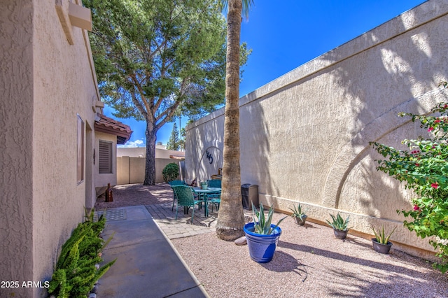 view of patio / terrace featuring outdoor dining area and a fenced backyard