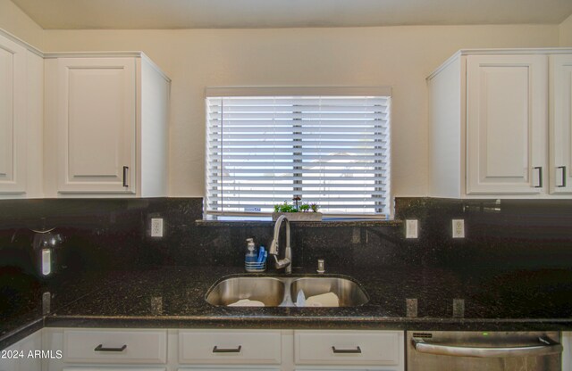 kitchen featuring white cabinetry, backsplash, sink, and dishwasher