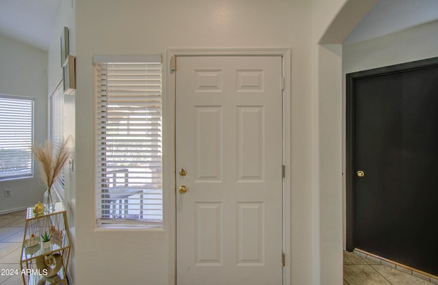 tiled entryway featuring plenty of natural light