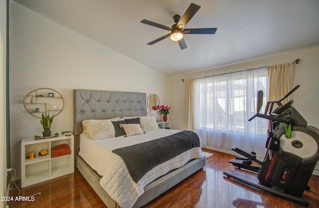 bedroom featuring lofted ceiling, dark wood-type flooring, and ceiling fan