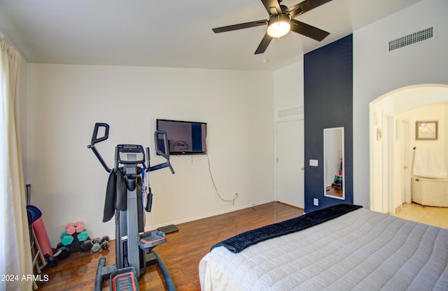 bedroom featuring lofted ceiling, hardwood / wood-style flooring, and ceiling fan