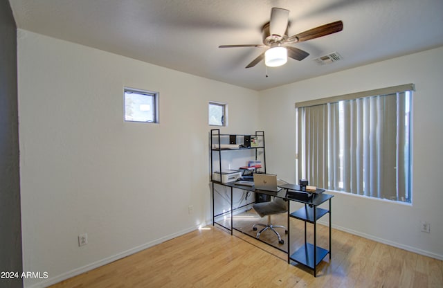 office space featuring light wood-type flooring and ceiling fan