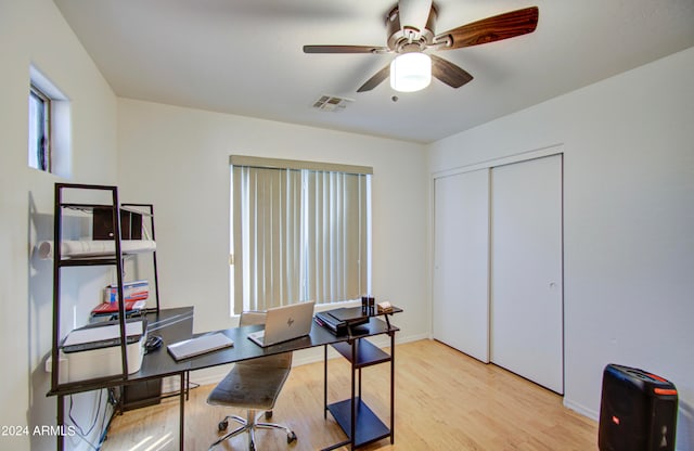 office space with ceiling fan and light hardwood / wood-style flooring