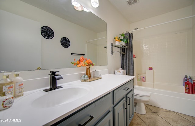 full bathroom with vanity, toilet, tile patterned floors, and shower / bath combo with shower curtain