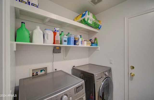 clothes washing area with separate washer and dryer