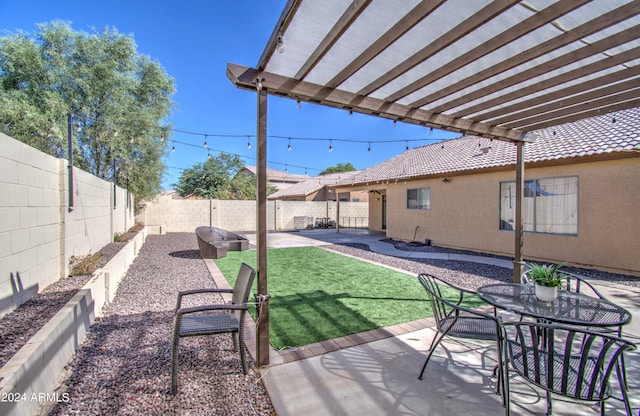 view of yard with a pergola and a patio area