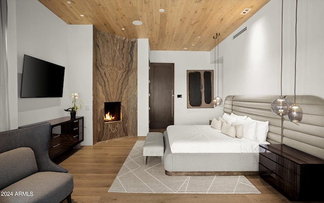 bedroom featuring wooden ceiling and light wood-type flooring