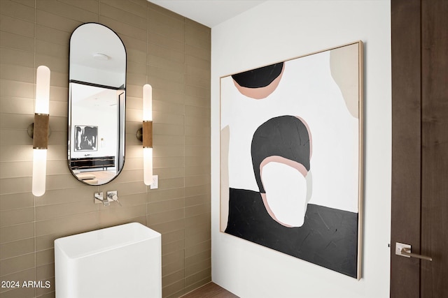 bathroom with tile walls and water heater